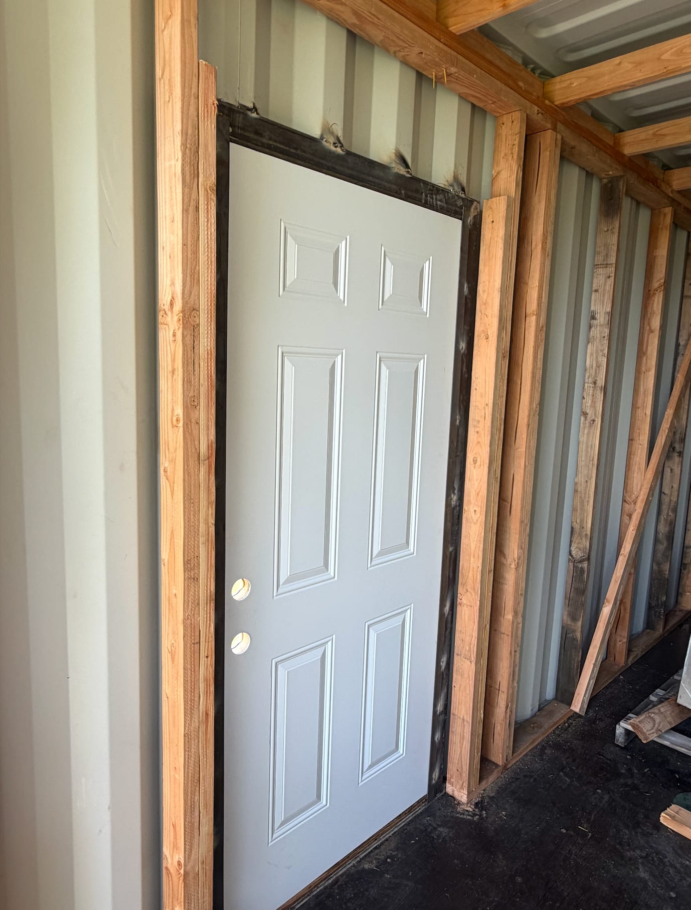 A door framed into the side of the container